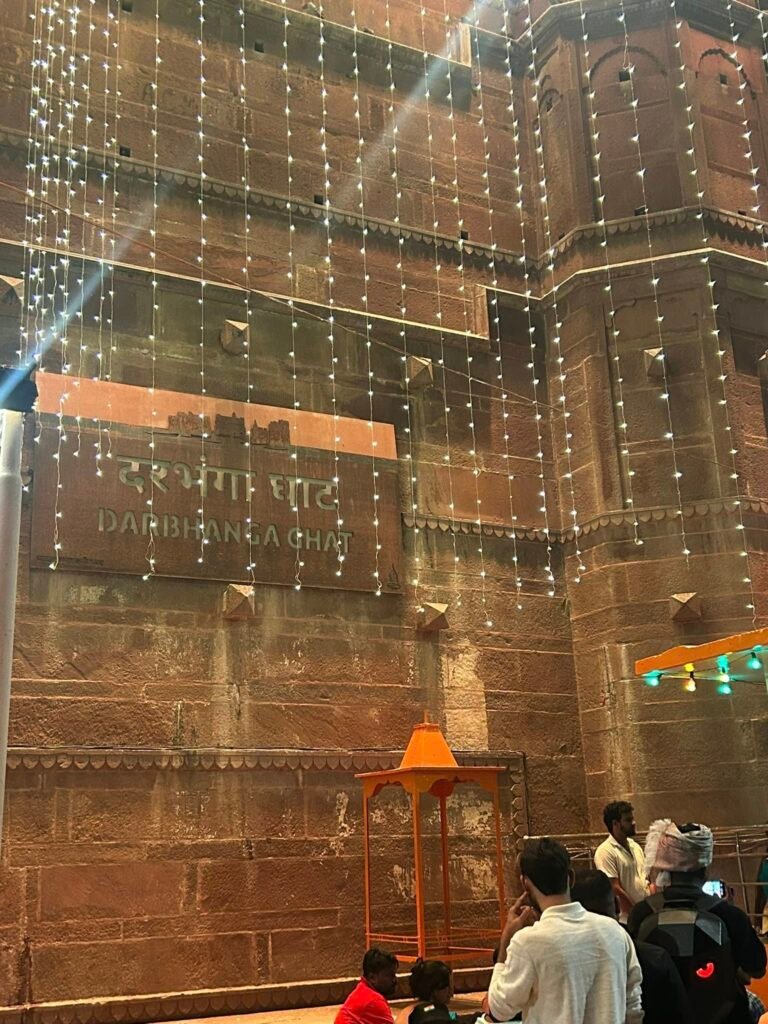 Historic Darbhanga Ghat in Varanasi with festive lights along the ghats of the Ganges