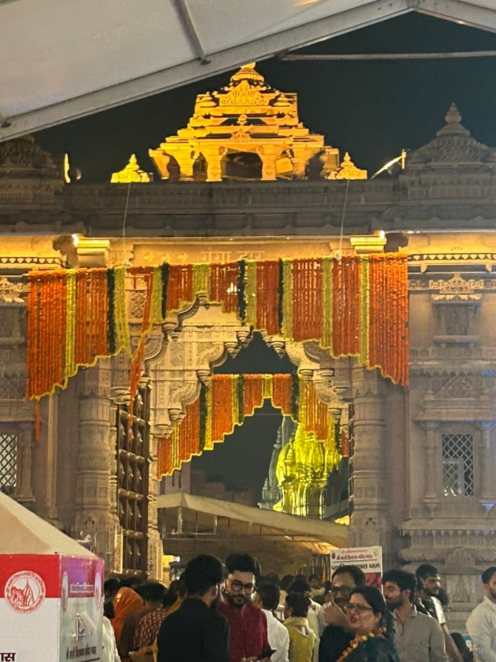 Devotees entering Kashi Vishwanath Temple in Varanasi during evening prayers