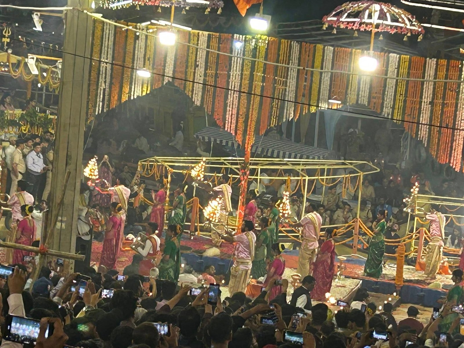 Priests performing the evening Ganga Aarti ritual at Dashashwamedh Ghat in Varanasi, India