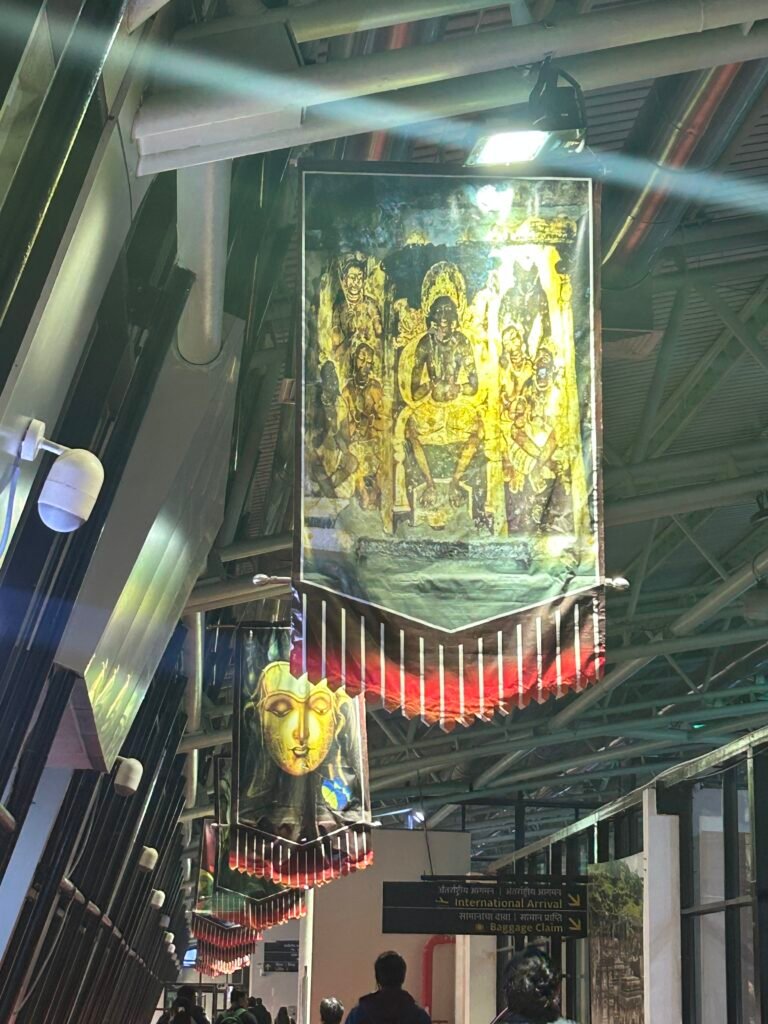 Ajanta cave painting banners displayed inside Aurangabad Airport welcoming visitors to the UNESCO heritage region.