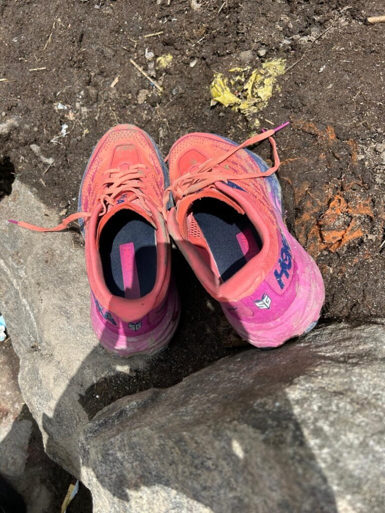 Real trekking isn’t clean—mud, sweat, and worn-out shoes are all part of the journey.