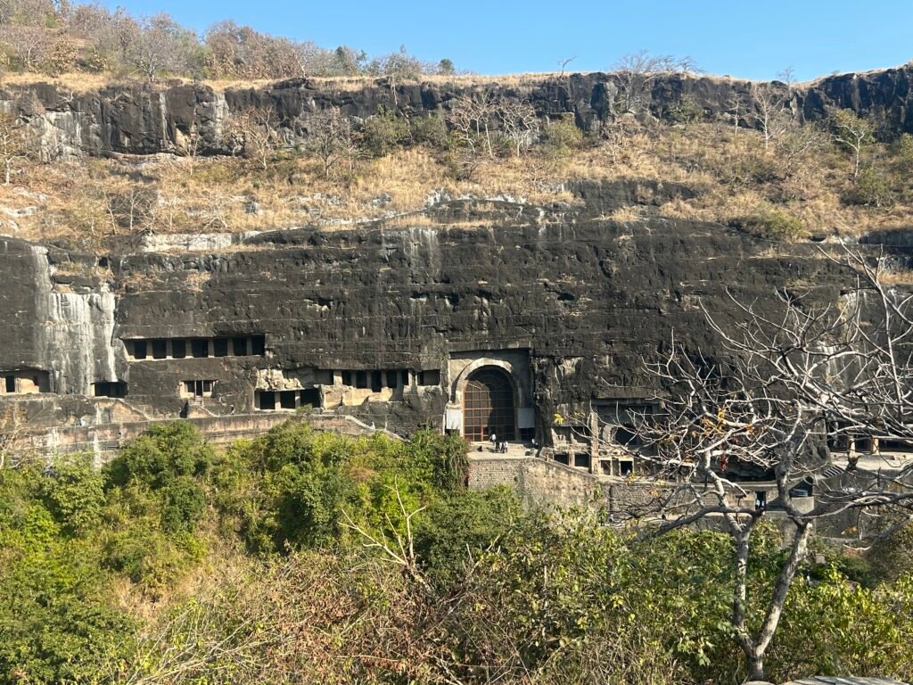 Rock-cut Buddhist caves of Ajanta carved into a horseshoe-shaped cliff