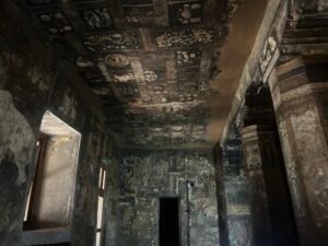 Ancient Ajanta cave murals illuminated by natural light